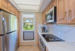 The remodeled kitchen features stove, oven, fridge/freezer, microwave and dishwasher